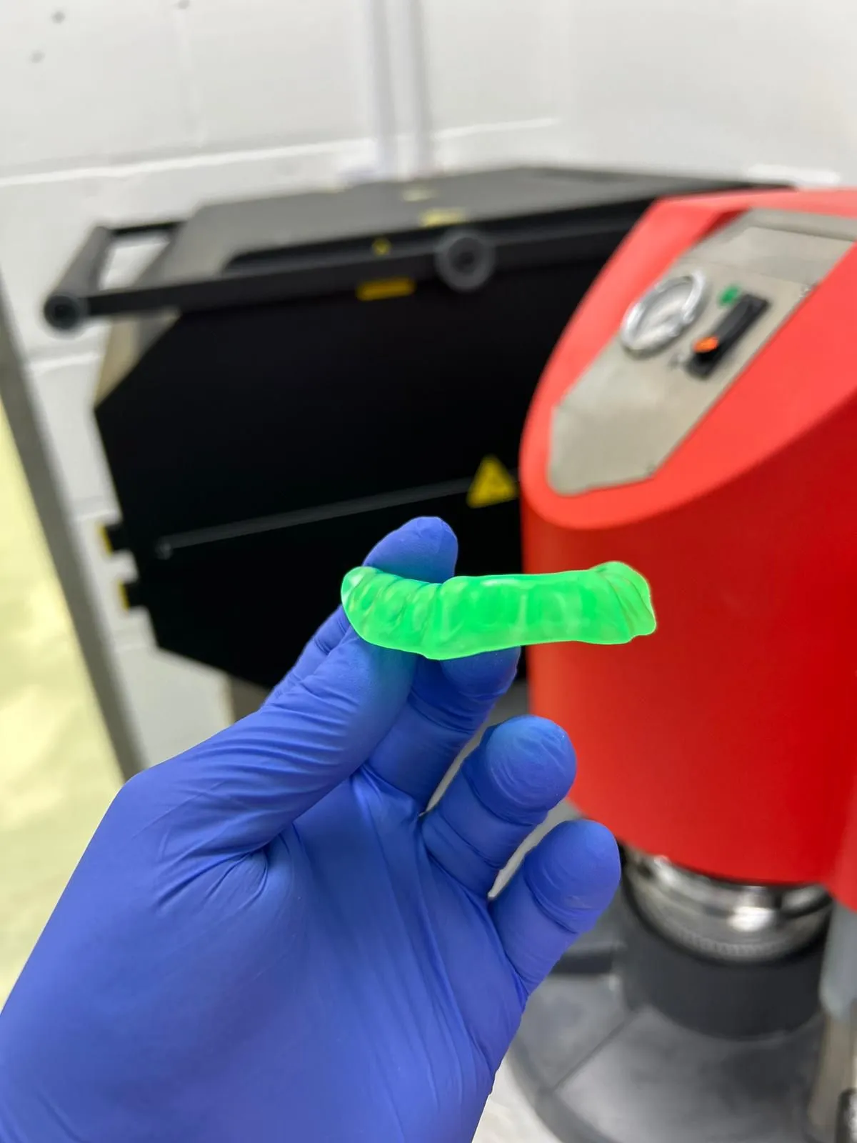 A bespoke green soft-hard nightguard made to prescription in our Dorset lab