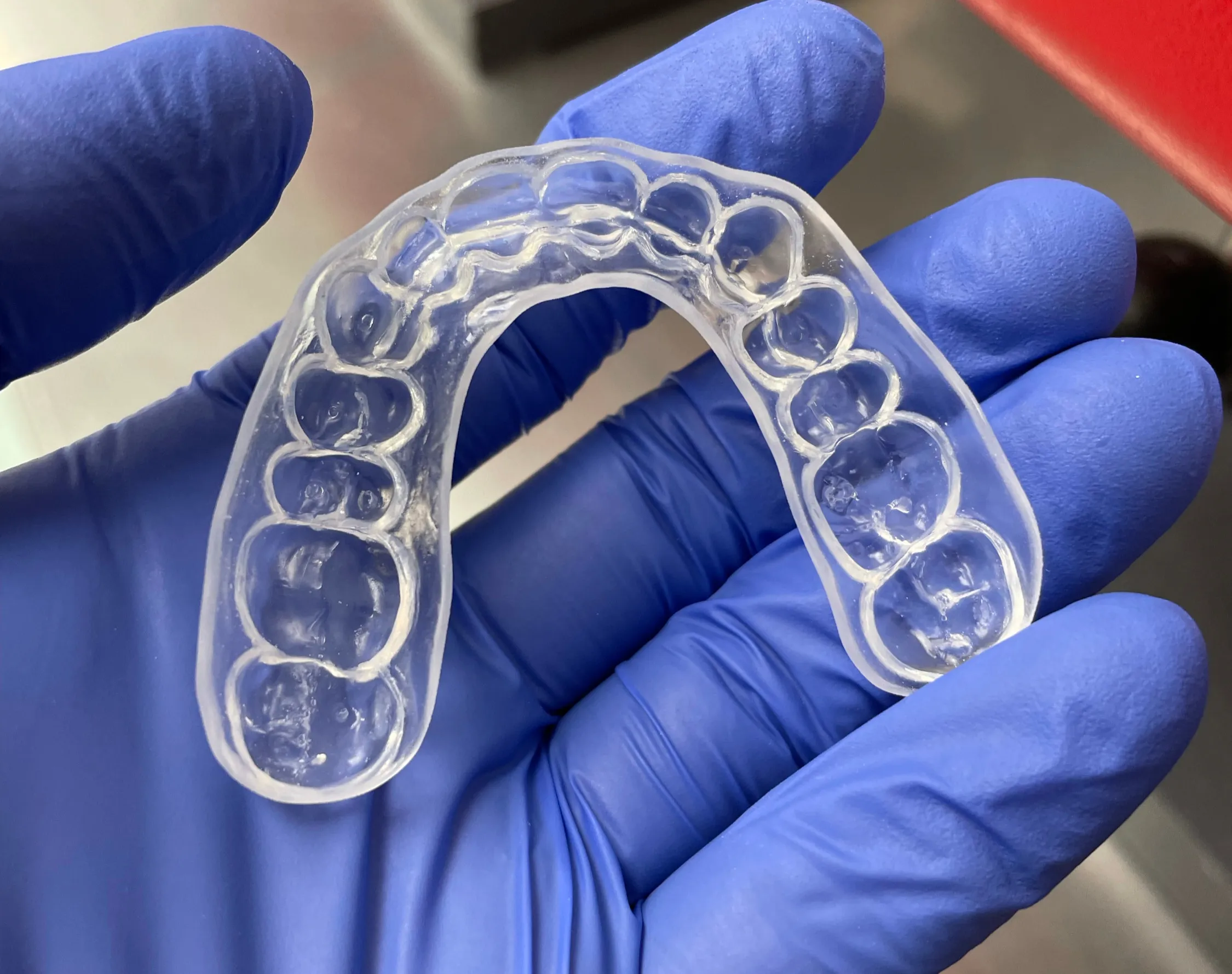 Clear custom nightguard crafted by Bridge Dental Laboratory