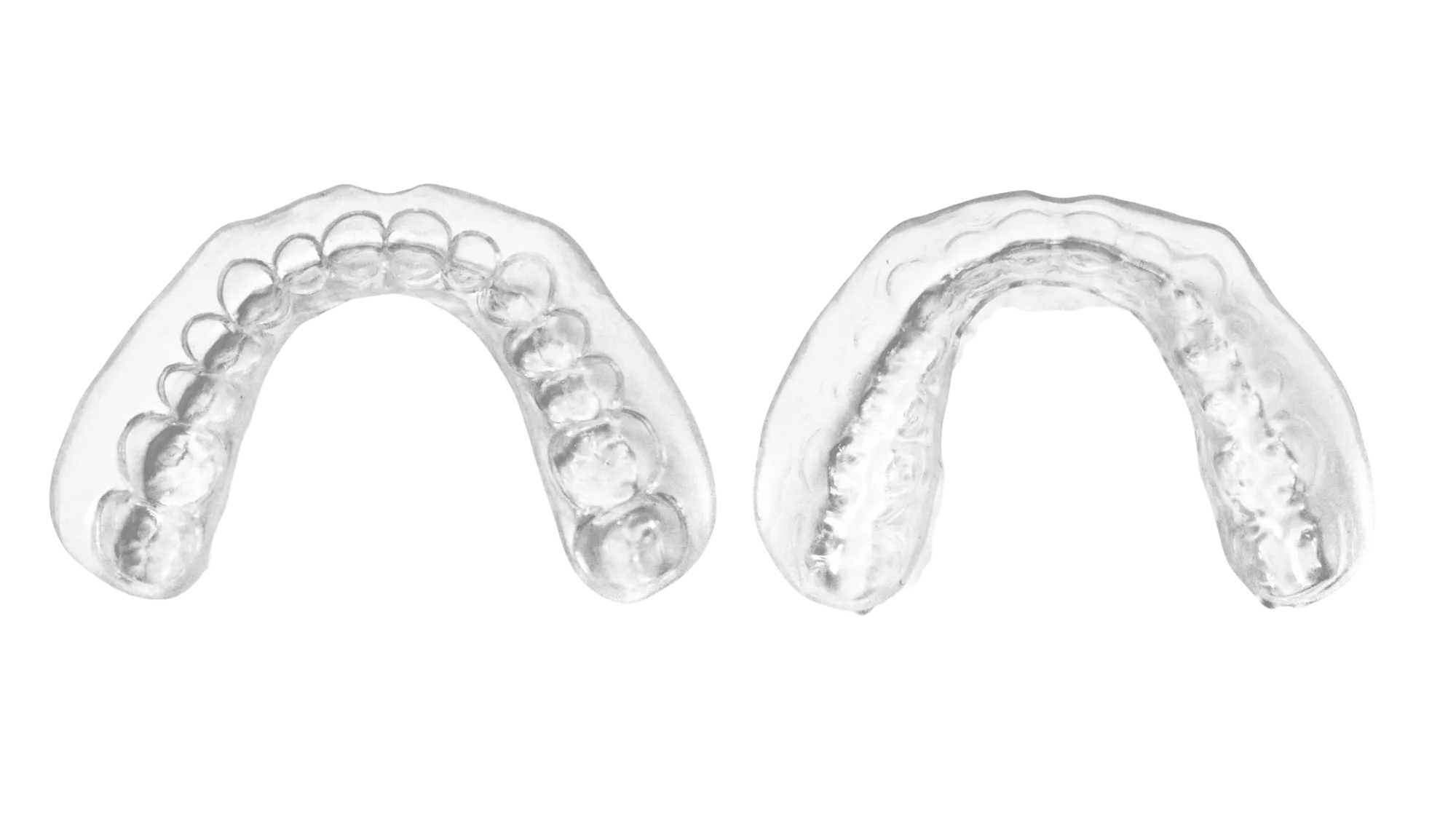 Two whitening trays side by side — a supersealed BDL tray with a smooth rolled edge next to a standard trimmed tray